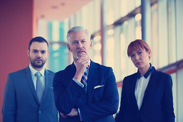 Image showing senior business man with his team at office