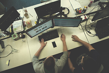 Image showing young programmers writing programming code top view