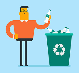 Image showing Man throwing plastic bottle into a recycling bin.