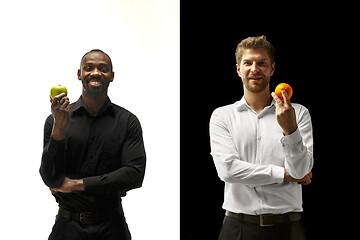 Image showing Men eating a fruits on a black and white background