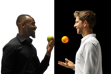 Image showing Men eating a fruits on a black and white background