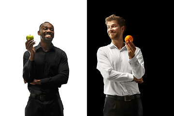 Image showing Men eating a fruits on a black and white background