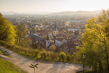 Image showing Panoramic view of Ljubljana, capital of Slovenia. Roooftops of Ljubljanas old medieval city center seen from Ljubljanas castle park at sunset