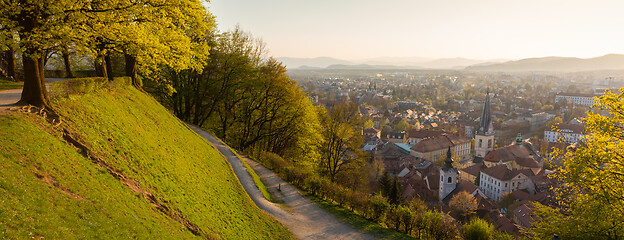 Image showing Panoramic view of Ljubljana, capital of Slovenia. Roooftops of Ljubljanas old medieval city center seen from Ljubljanas castle park at sunset