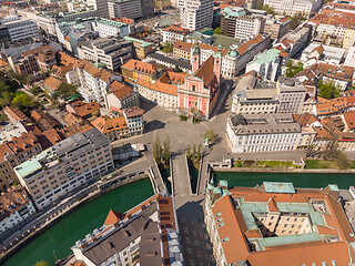 Image showing Aerial drone view of Preseren Squere and Triple Bridge over Ljubljanica river,Tromostovje, Ljubljana, Slovenia. Empty streets during corona virus pandemic social distancing measures