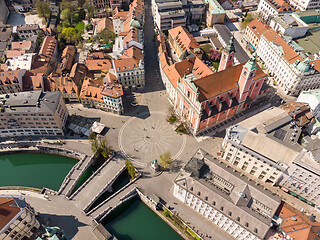 Image showing Aerial drone view of Preseren Squere and Triple Bridge over Ljubljanica river,Tromostovje, Ljubljana, Slovenia. Empty streets during corona virus pandemic social distancing measures