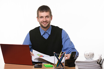 Image showing smiling office worker works with documents on a white background