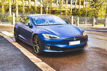 Image showing Blue Tesla Model S on Rainy Morning