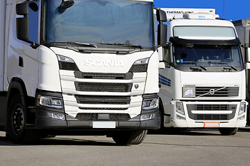 Image showing Two White Freight Trucks