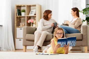 Image showing student girl with textbook learning at home