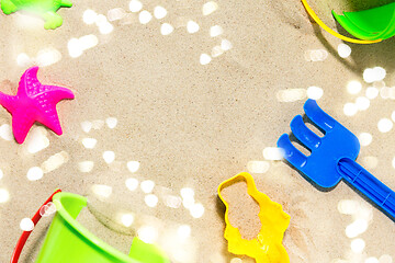 Image showing close up of sand toys kit on summer beach