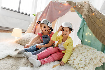 Image showing girls with pots playing in kids tent at home