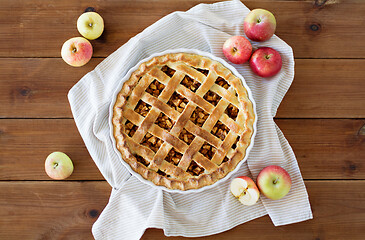 Image showing apple pie in baking mold on wooden table