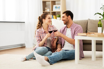 Image showing happy couple drinking red wine at home