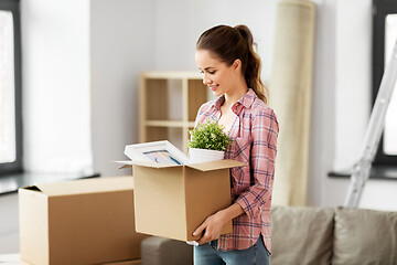 Image showing happy woman with stuff moving to new home