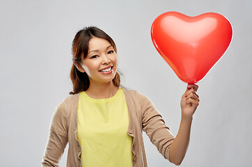 Image showing happy asian woman with red heart shaped balloon