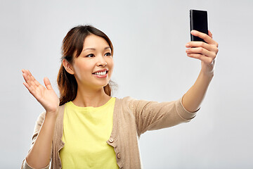 Image showing asian woman taking selfie by smartphone