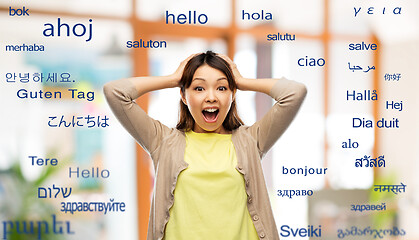 Image showing happy asian woman over foreign words