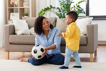 Image showing mother and baby playing with soccer ball at home