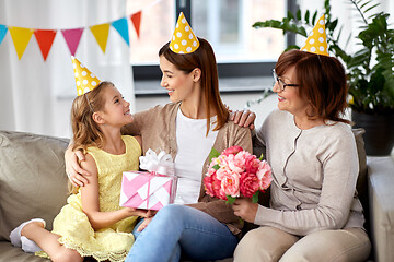 Image showing daughter with gift box greeting mother on birthday