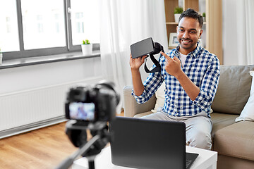 Image showing male blogger with vr glasses videoblogging at home