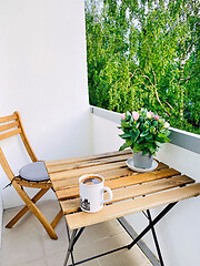 Image showing cup of coffee on balcony table