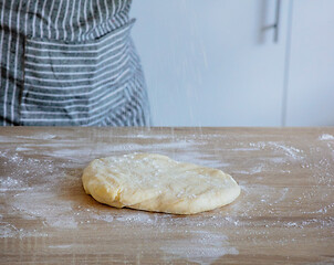 Image showing flour falls on the dough