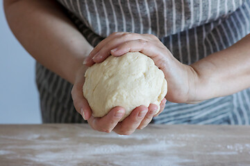 Image showing yeast dough and human arms