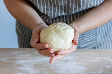 Image showing yeast dough and human arms