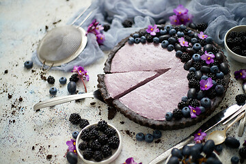 Image showing Homemade piece of delicious blueberry, blackberry and grape pie 