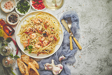 Image showing Seafood concept. Pasta with shrimps in a plate, close-up, copy space, top view, flat lay.