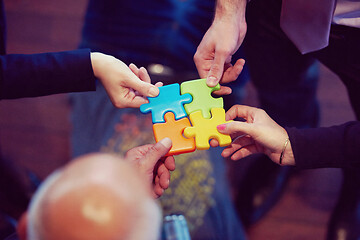 Image showing assembling jigsaw puzzle