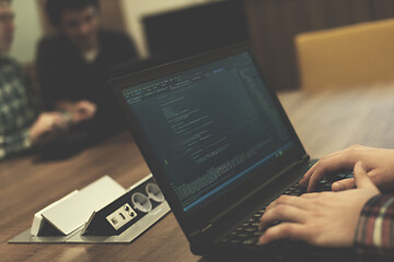 Image showing programmer writing programming code