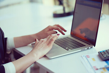 Image showing business woman working on computer at office