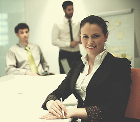 Image showing young business woman on meeting  using laptop computer