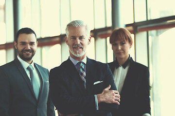 Image showing senior business man with his team at office