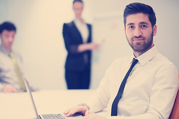 Image showing young business man at meeting