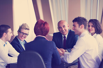 Image showing business people group on meeting at modern bright office