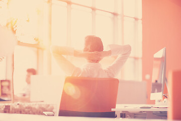 Image showing young business woman relaxing at workplace