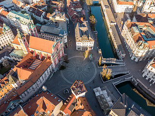 Image showing Aerial drone view of Preseren Squere and Triple Bridge over Ljubljanica river,Tromostovje, Ljubljana, Slovenia. Empty streets during corona virus pandemic social distancing measures