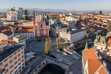 Image showing Aerial drone view of Preseren Squere and Triple Bridge over Ljubljanica river,Tromostovje, Ljubljana, Slovenia. Empty streets during corona virus pandemic social distancing measures