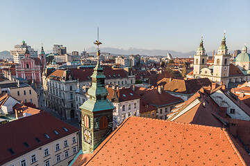 Image showing Scenic panoramic aerial drone view of rooftops of medieval city center, town hall and cathedral church in Ljubljana, capital of Slovenia, at sunset