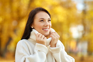 Image showing portrait of happy young woman in autumn park