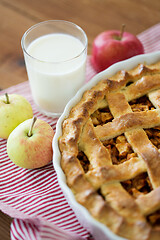 Image showing apple pie in baking mold on wooden table