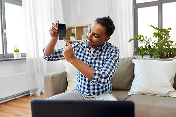 Image showing male blogger with smartphone videoblogging