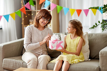 Image showing grandmother giving granddaughter birthday gift