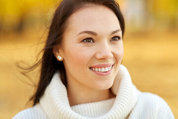 Image showing portrait of happy young woman in autumn park