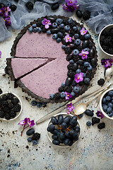 Image showing Sweet and tasty tart with fresh blueberries, blackberries and gr