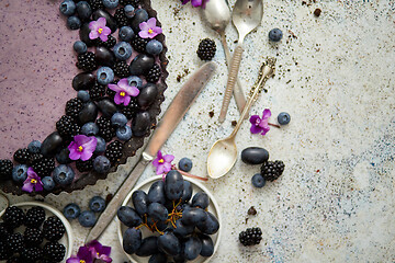 Image showing Sweet and tasty tart with fresh blueberries, blackberries and gr