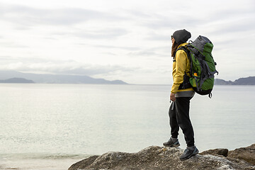 Image showing Woman exploring the coast